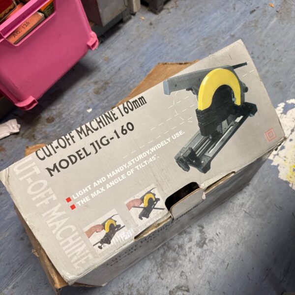 Vintage cut off machine in original packaging.