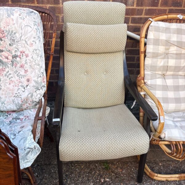 Vintage Danish highback armchair with textured upholstery and wooden frame.