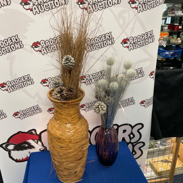 Rustic decorative vase with artificial flower arrangement for home decor.
