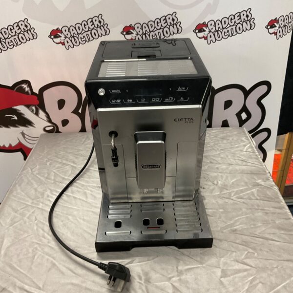 DeLonghi Eletta Plus coffee machine, front view, black and silver.