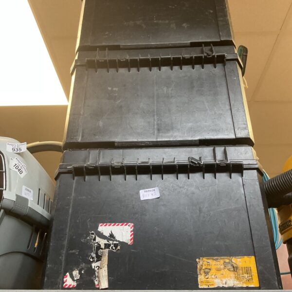 Black DeWalt TSTAK storage box for tools and hardware.