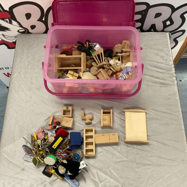 Box of vintage dolls house furniture and assorted keyrings.