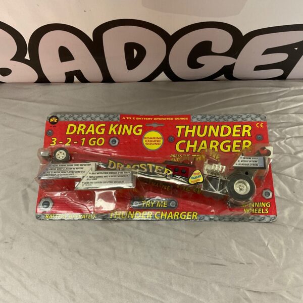 Vintage Drag King Thunder Charger toy car, side view.