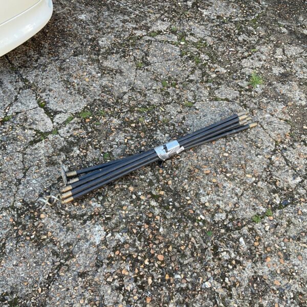 Set of used drain rods for clearing blocked drains.