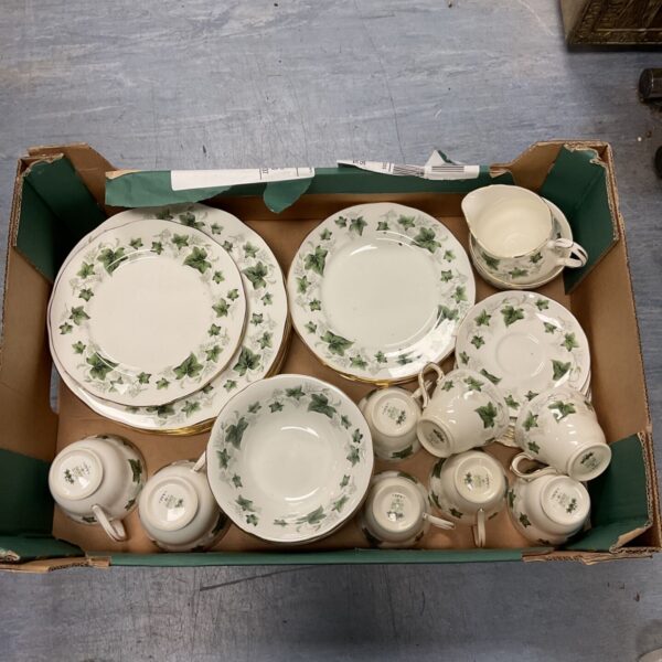 Vintage Duchess Ivy pattern tea set with cups, saucers, and plates.