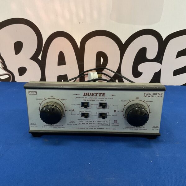 Vintage Duette twin power supply unit with labelled switches.