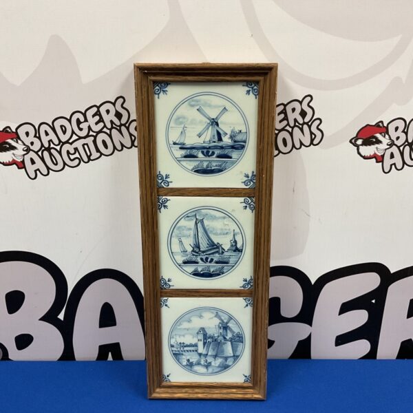 Antique Dutch Delft tile panel with windmill and sailing ship scenes.