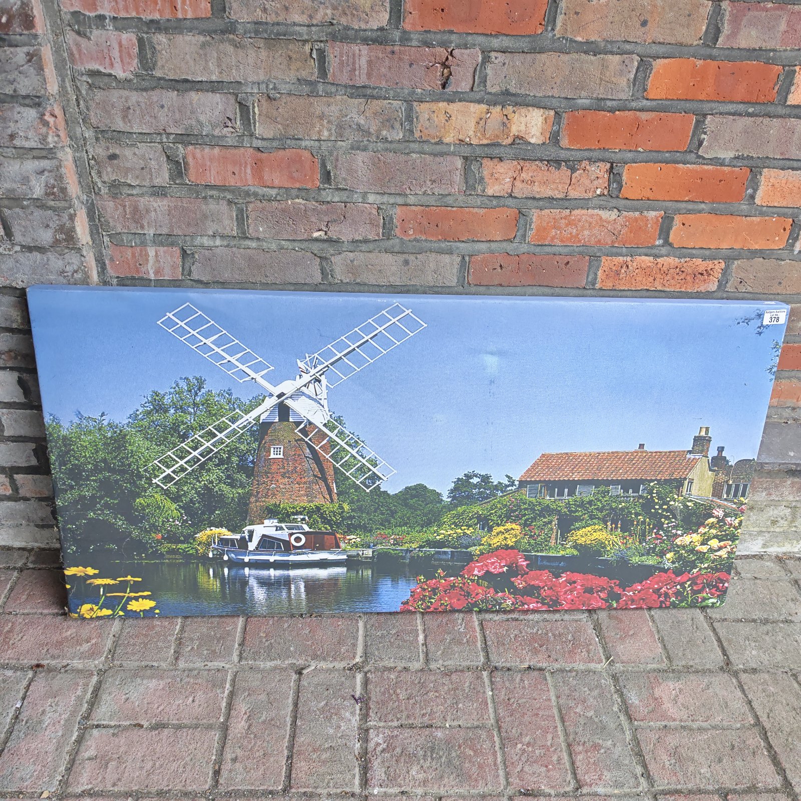 Large canvas print of a Dutch windmill beside a tranquil canal.