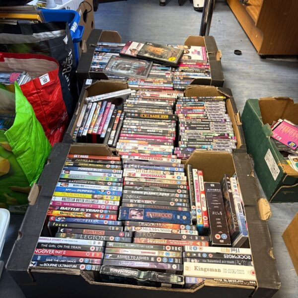 Mixed DVD movie lot in three boxes, ready for a new home.
