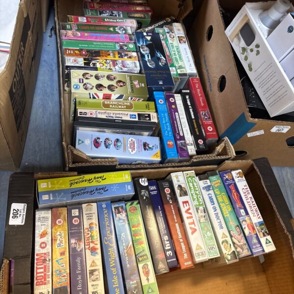 Selection of DVDs and VHS tapes for vintage media collectors.