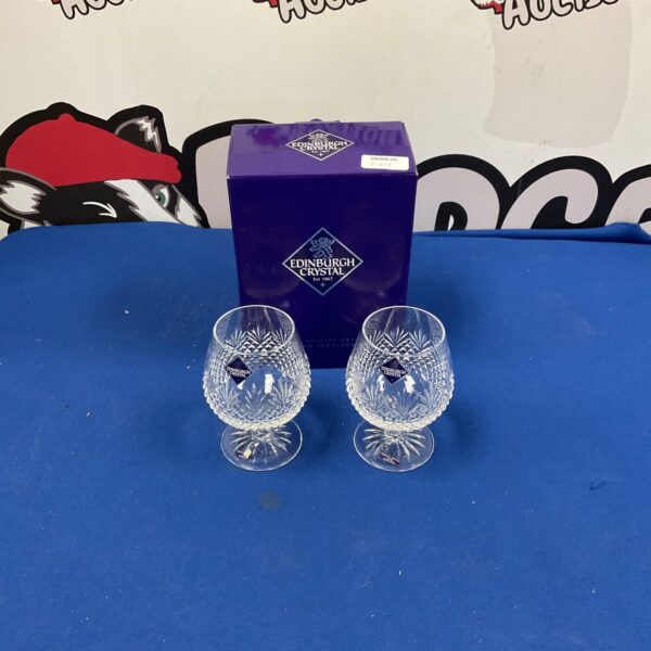 Two Edinburgh Crystal brandy glasses with cut detailing.
