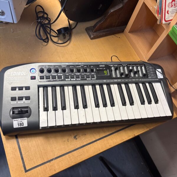Edirol PCR-M3 keyboard controller for music production and MIDI control.