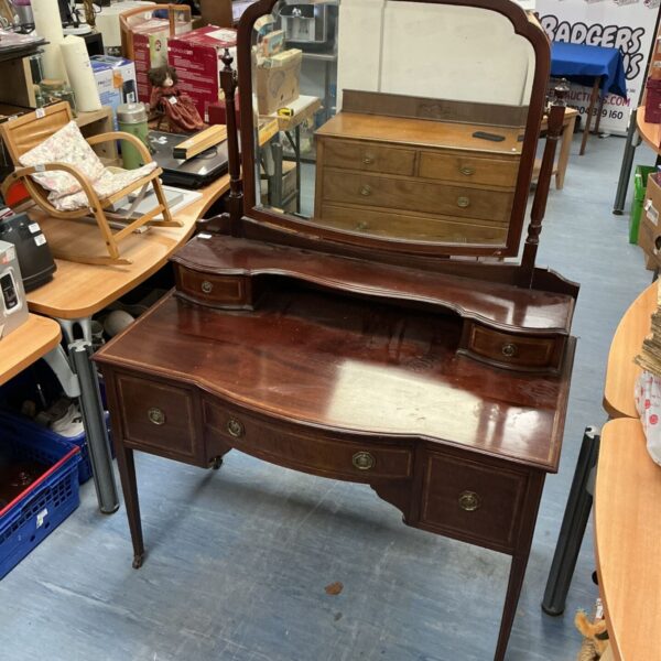Antique Edwardian mahogany dresser table with mirror, ideal for bedroom storage.