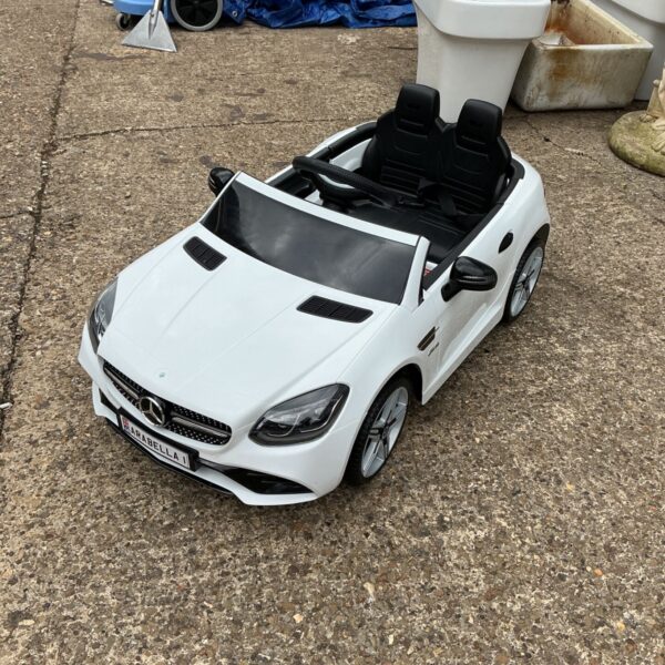 White electric ride on Mercedes SLC300 toy car for children.