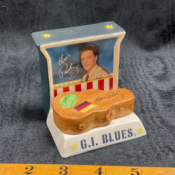 Vintage Elvis Presley G.I. Blues cruet set with cap and boot design.