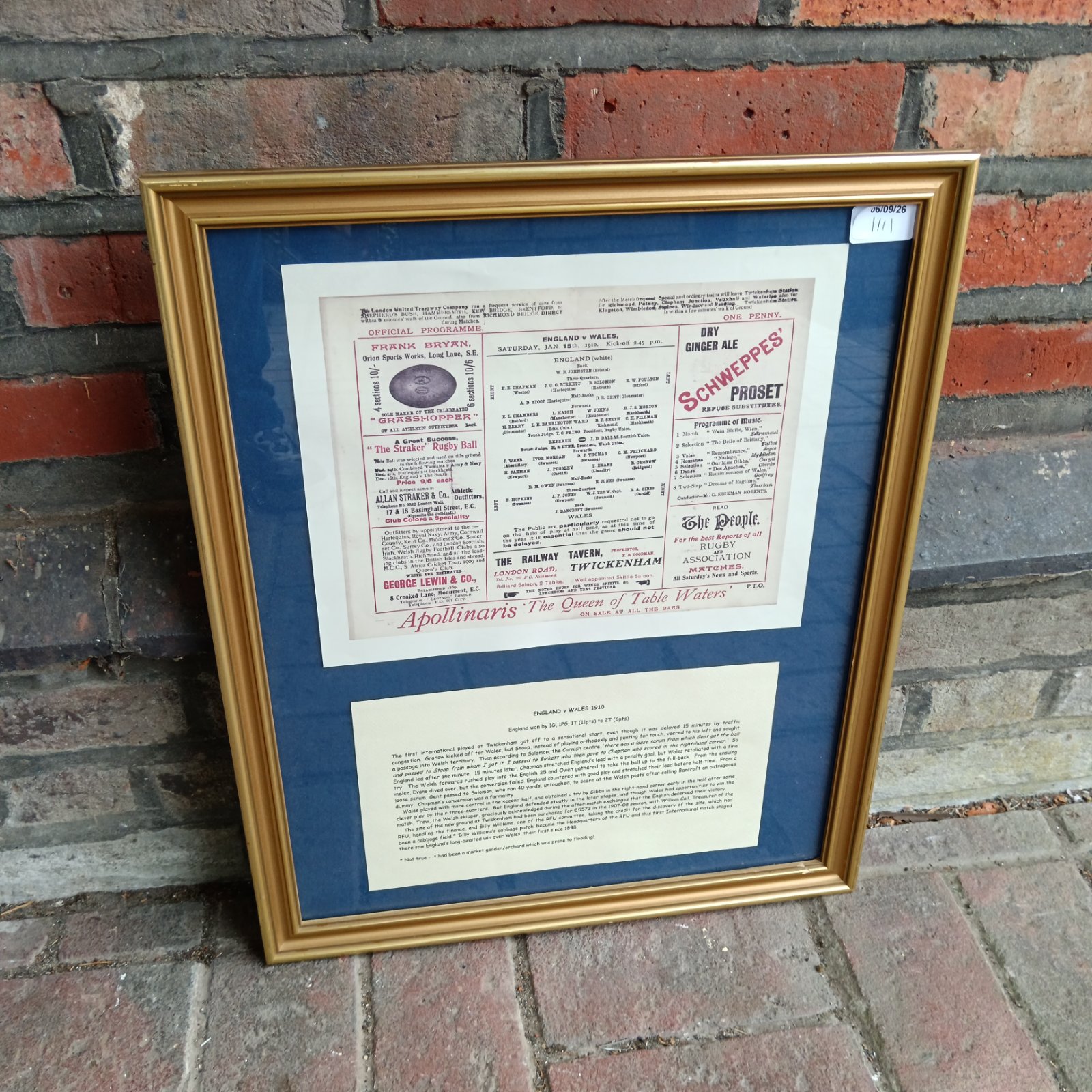 Framed 1910 England v Wales rugby team sheet print.