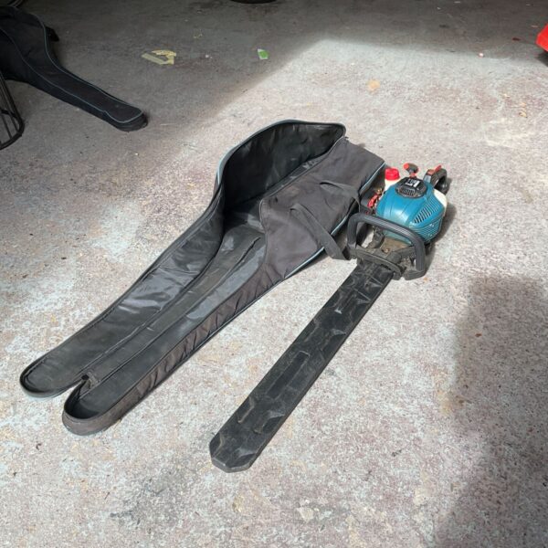 Erbauer petrol hedge cutter in storage bag, garden tool.