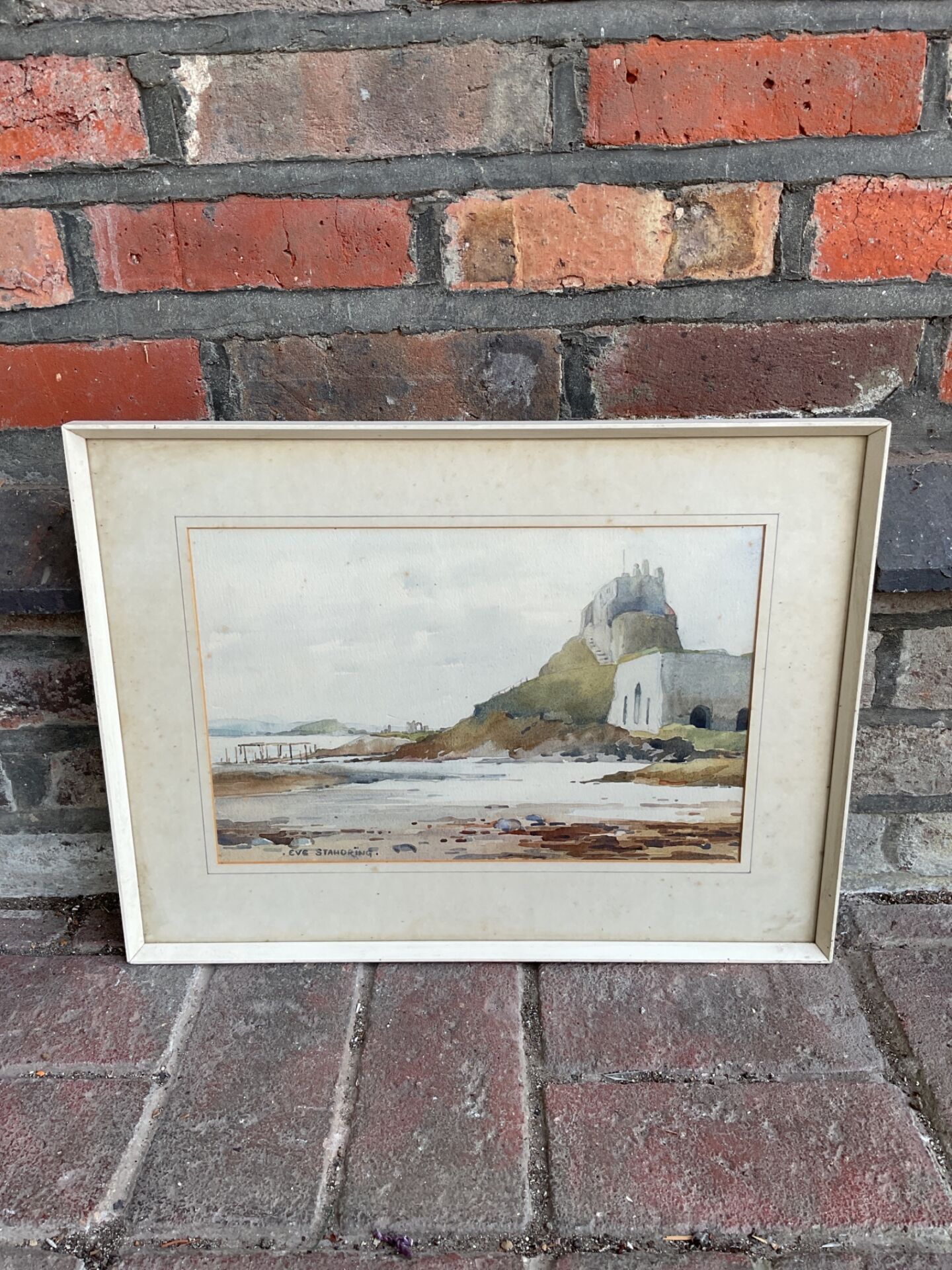 764 Eve standring signed watercolour of holy island castle