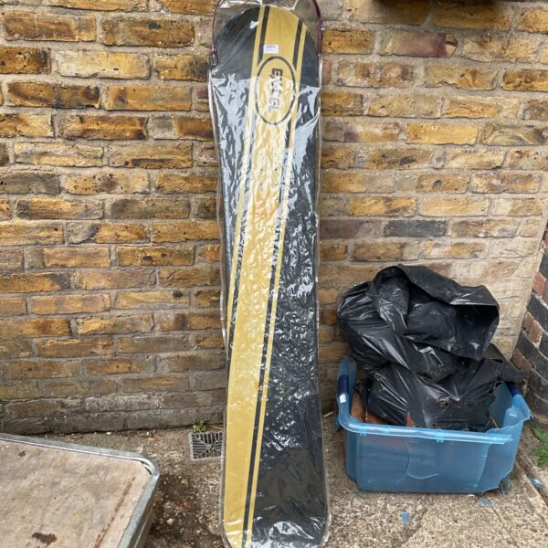 Vintage Excel snowboard with a colourful graphic design.