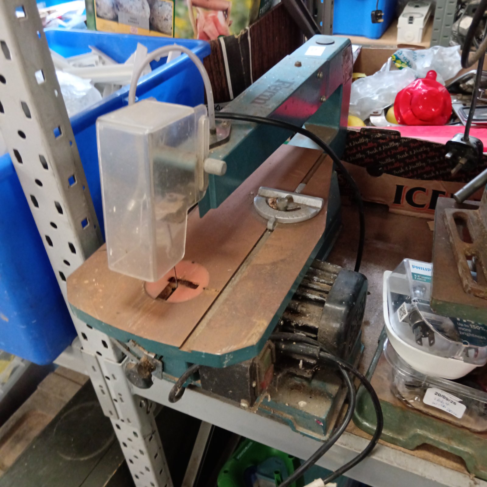 Vintage Ferm scroll saw on a workbench, ideal for DIY projects.