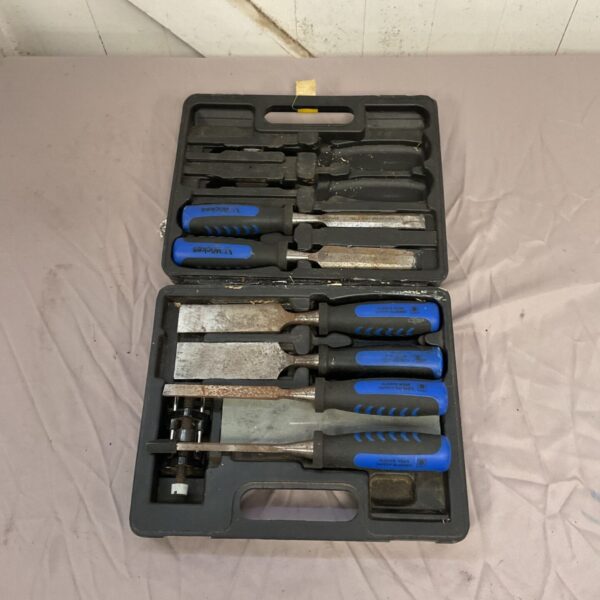 Toolbox containing a set of metal files with blue handles.