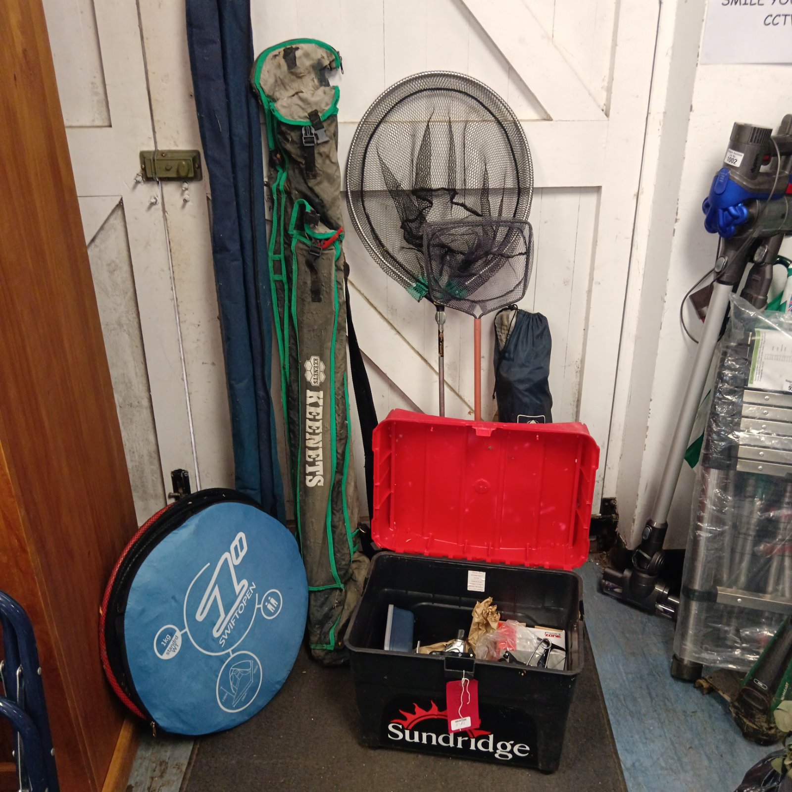 Fishing tackle lot including nets, boxes and carry case.