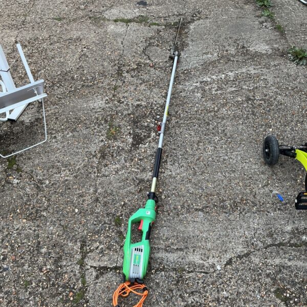 Florabest FHL 900 C4 electric hedge trimmer for garden maintenance.