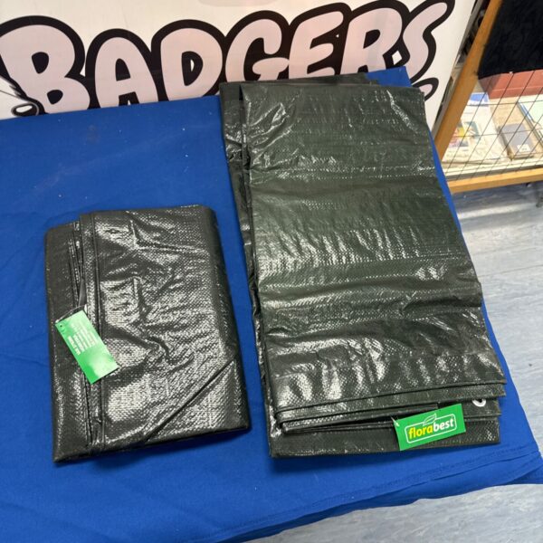 Two new Florabest gardening tarpaulins stacked together.