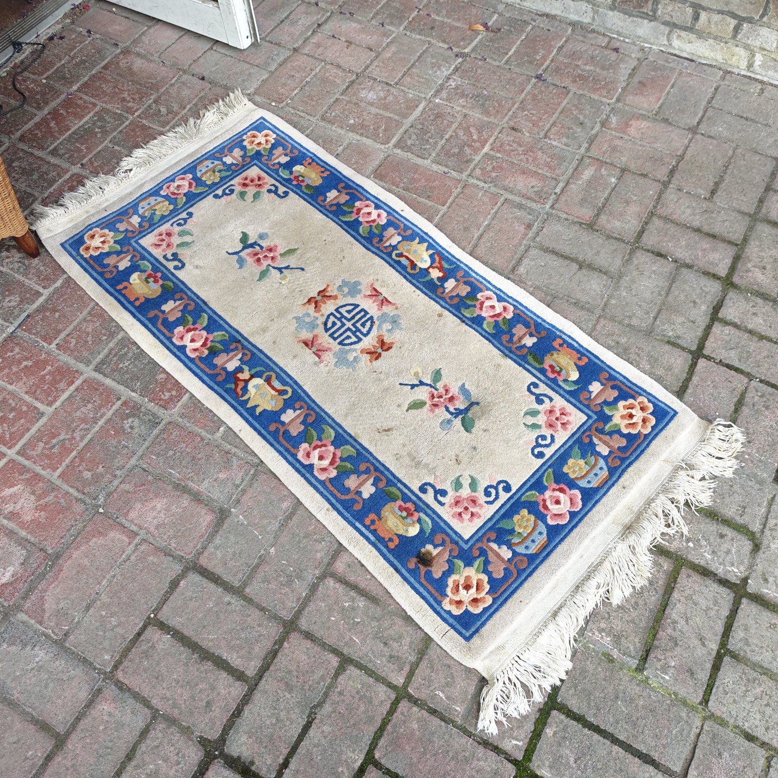 Vintage floral runner rug with a detailed pattern.