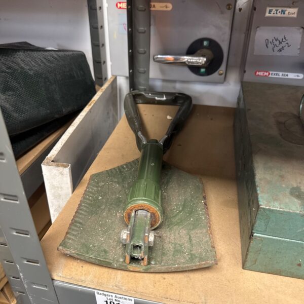 Vintage folding military shovel, a classic army entrenching tool.