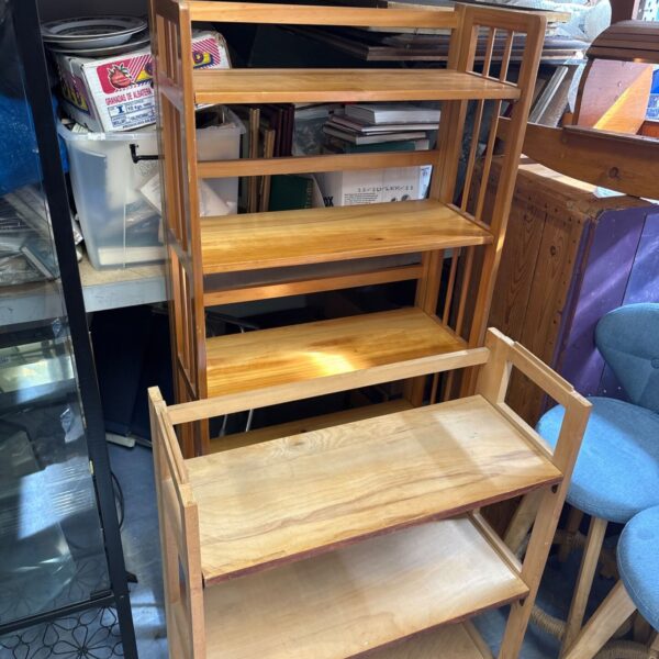 Rustic folding pine bookshelves for storage and display.