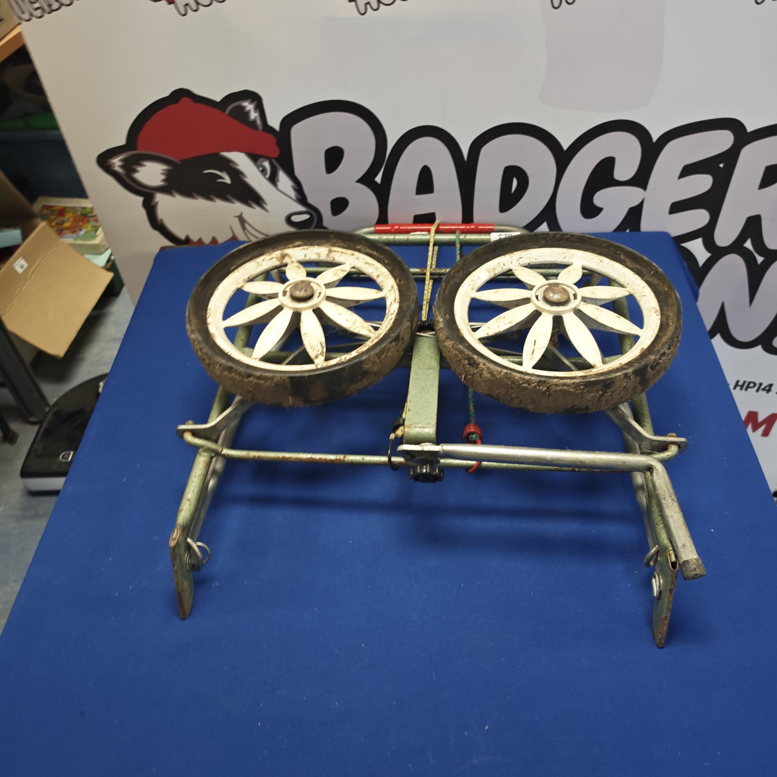 Vintage folding sack barrow wheel set with spoked metal wheels.