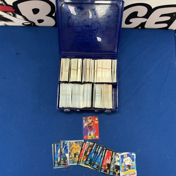 Assorted football trading cards in a storage box.