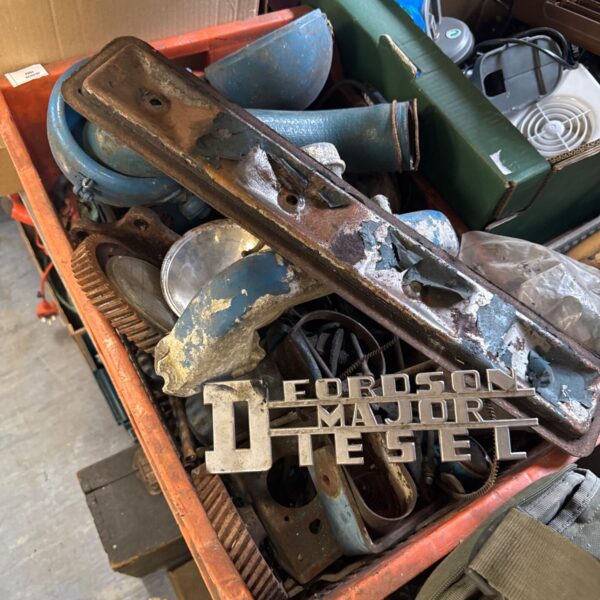 Box of vintage Fordson Major Diesel tractor parts for restoration.