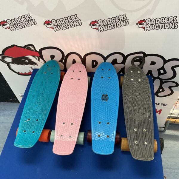 Lot of four colourful penny boards for sale.
