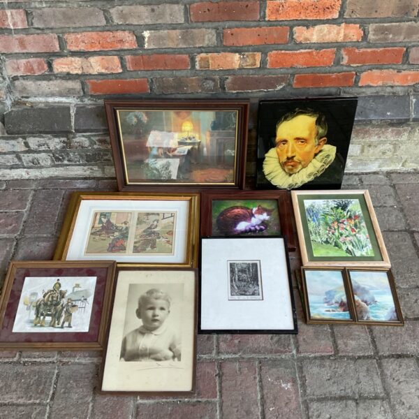 Framed art collection featuring a Shakespeare portrait and Japanese woodblock print.