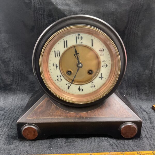 Antique French A D Mougin mantle clock with white enamel dial.