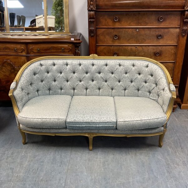 Vintage French settee with giltwood frame and button tufting.