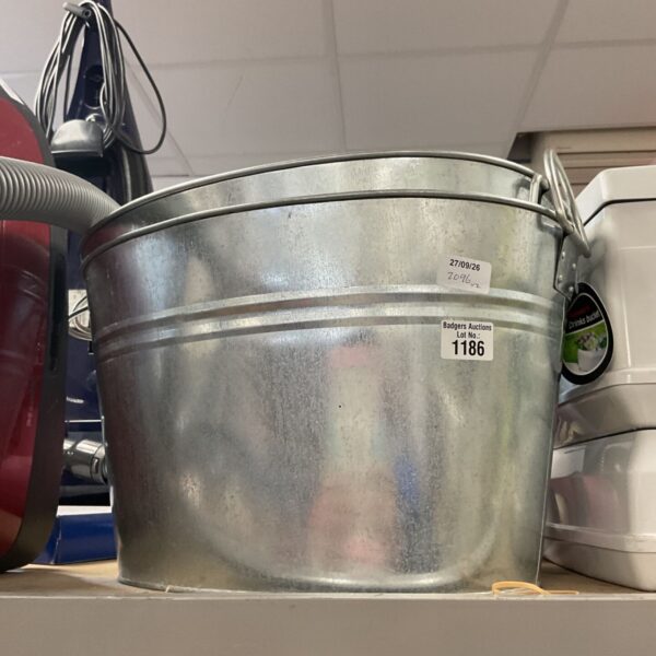 Galvanised steel drinks bucket with a weathered patina.
