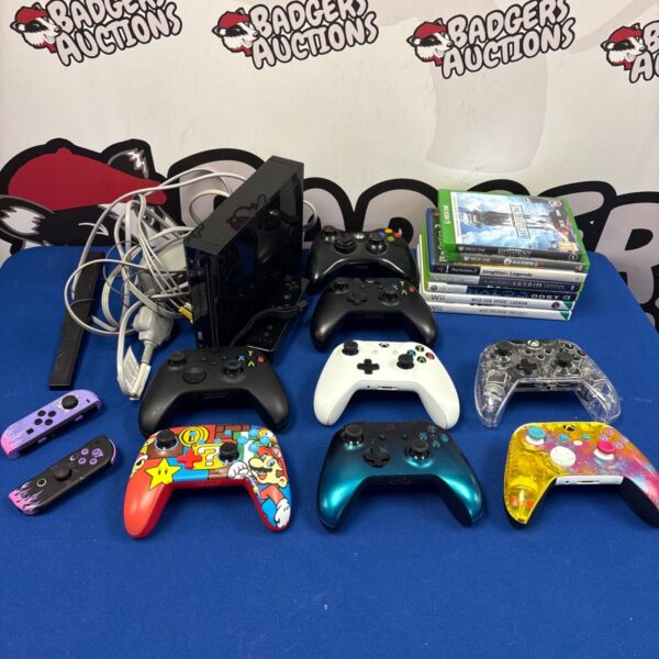 Gaming console bundle lot including Nintendo, Xbox, and PlayStation systems.