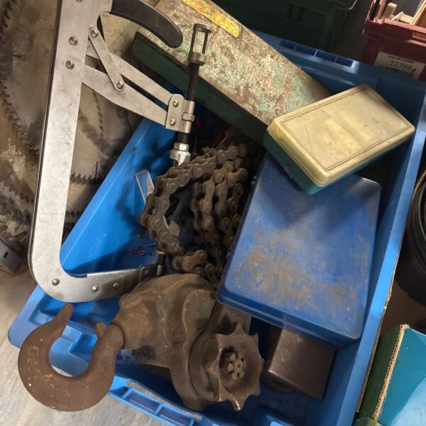 Garage clearance lot with heavy chain and pulley system.