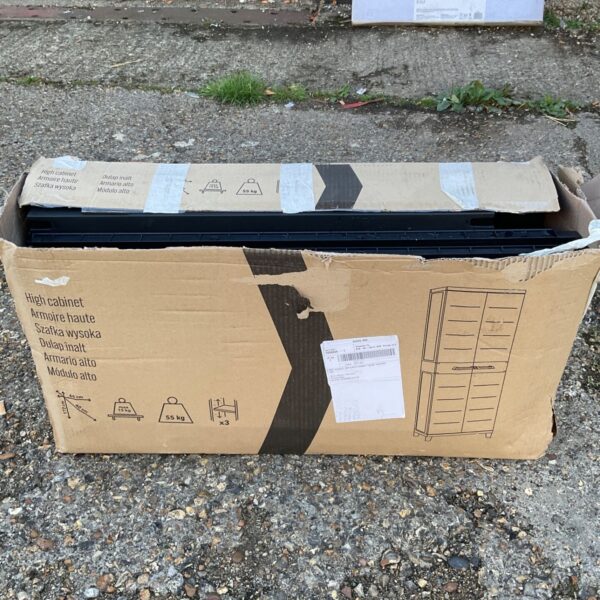 Plastic garden storage unit in original box, ready for outdoor use.