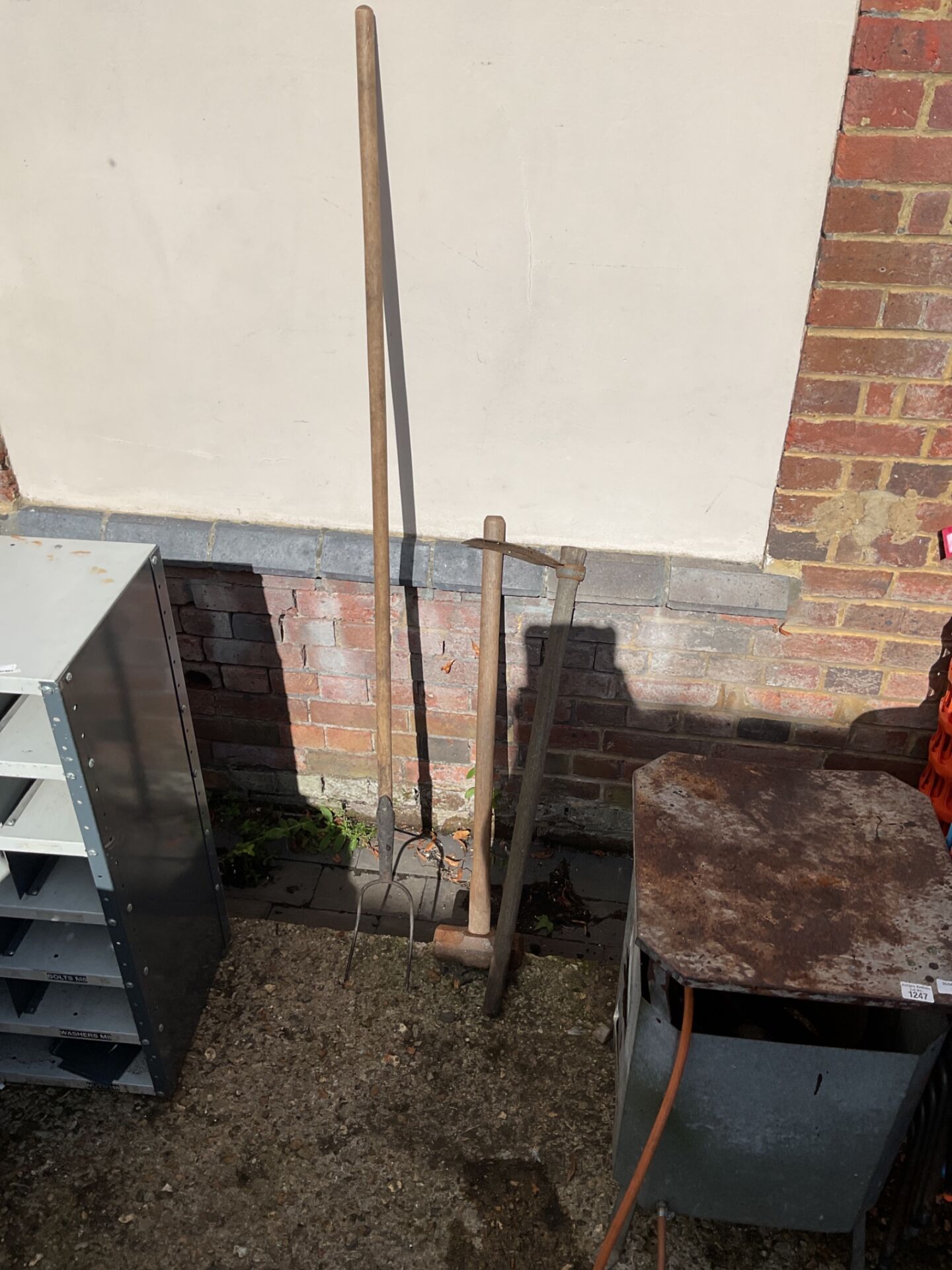 1174 Sledgehammer, pitchfork, and a mattock