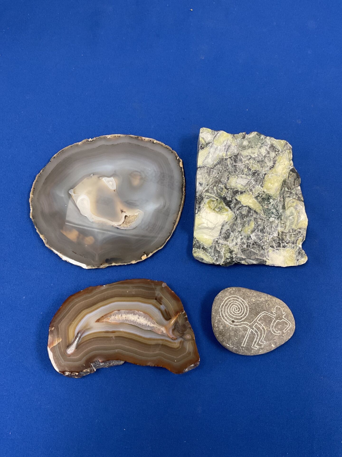 048 Two slices of geode rock, slab of dallasite & nazca monkey engraved stone