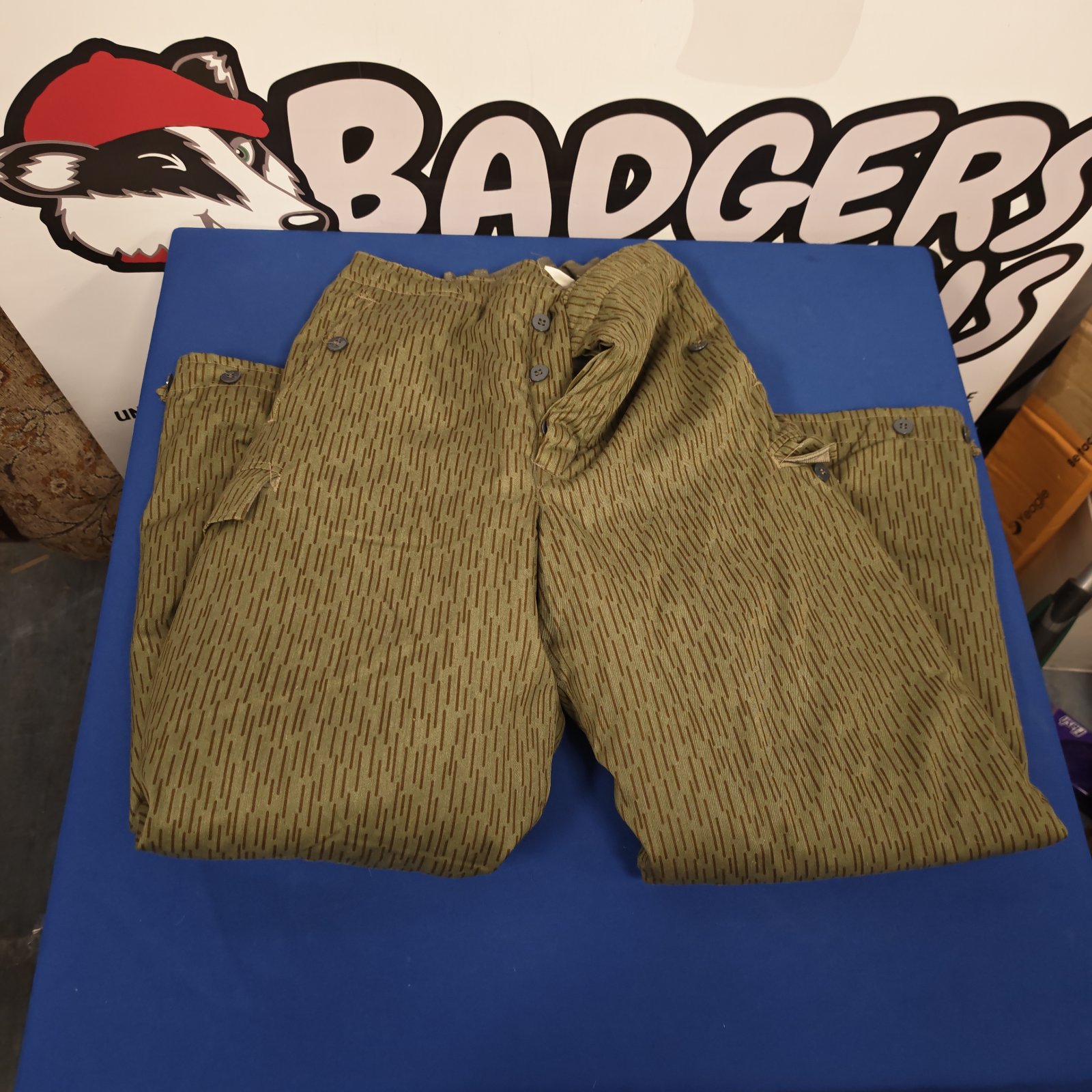 Vintage German G44 winter trousers in mottled camouflage pattern.