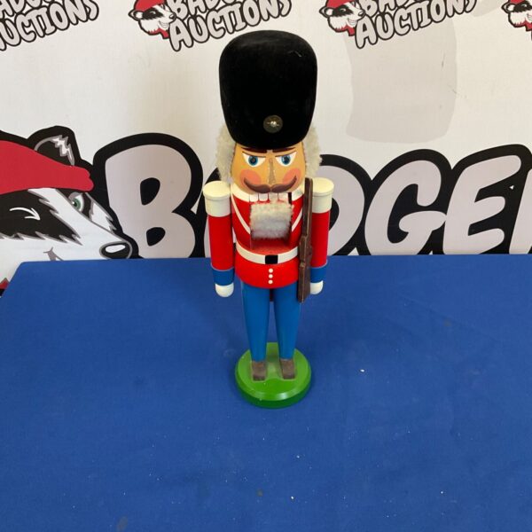 Antique German nutcracker soldier figurine, detailed wooden collectible.
