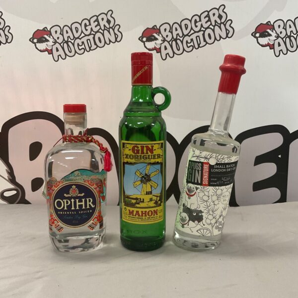 Collection of three gin bottles including Opihr, 3 Pugs, and Zoriglier.