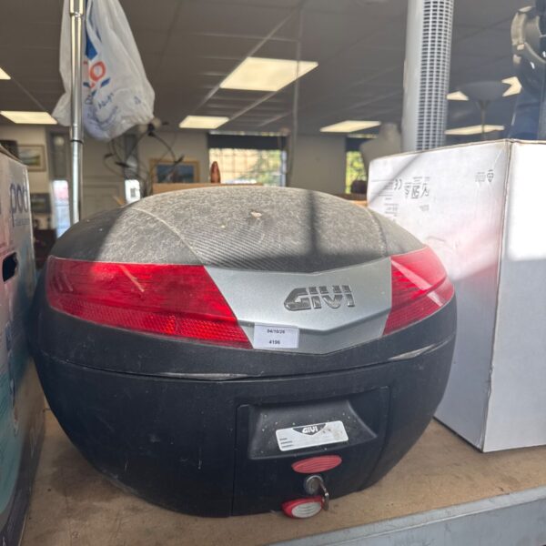Black Givi E460 motorcycle pillion box with a locking mechanism.