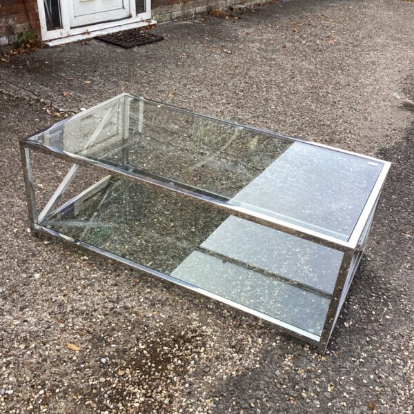 Vintage glass and chrome coffee table in a domestic setting.