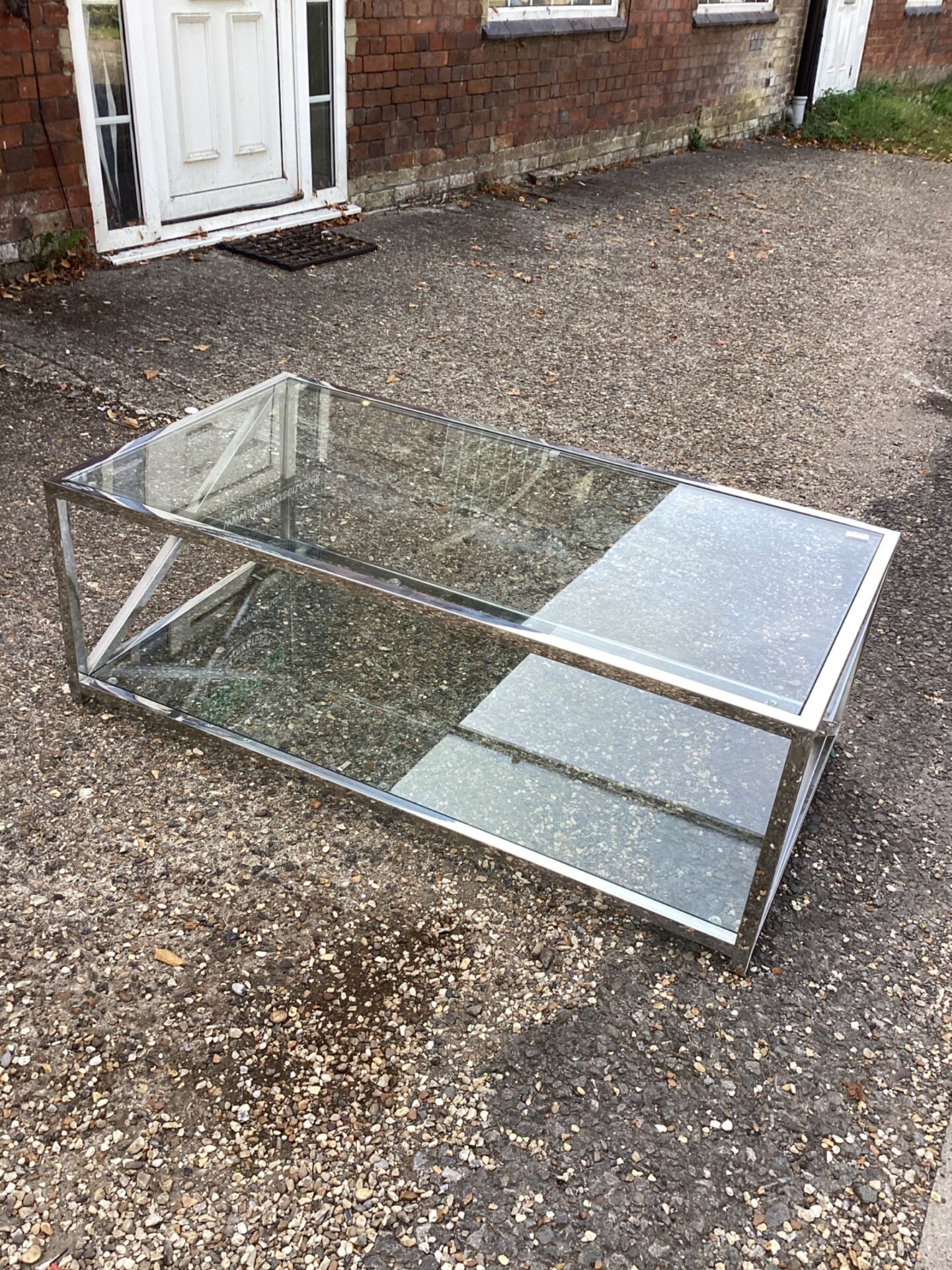 1414 Glass and chrome coffee table